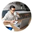 Professional trader working on a laptop with market data